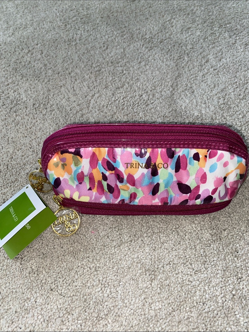 Trina & Co Zip pencil case pouch NWT
Multi colored 
Gold color hardware